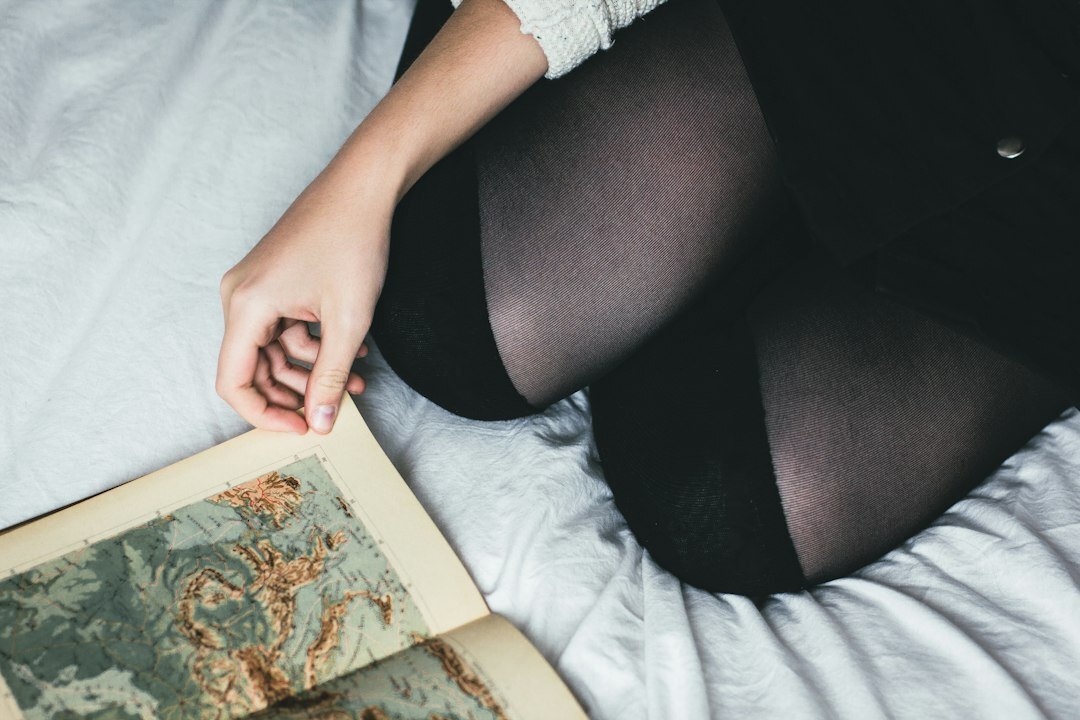 Person reading a cultural magazine at home in Germany