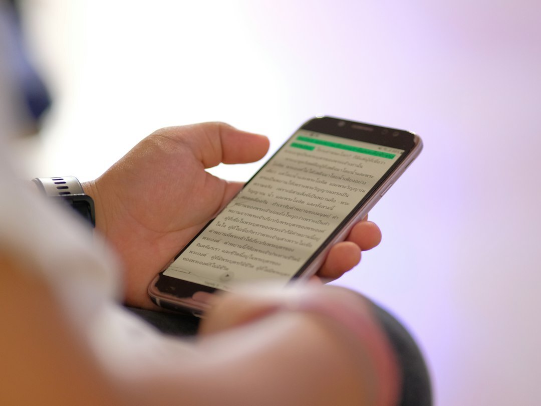 person reading news on phone